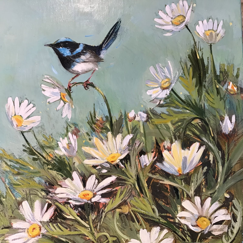 Blue Fairy wren is perched amongst white daisy flowers against a pale blue background

